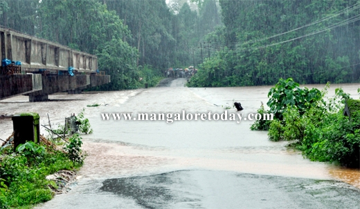 Heavy rains submerge Kumaradhara Bridge ; road traffic hit